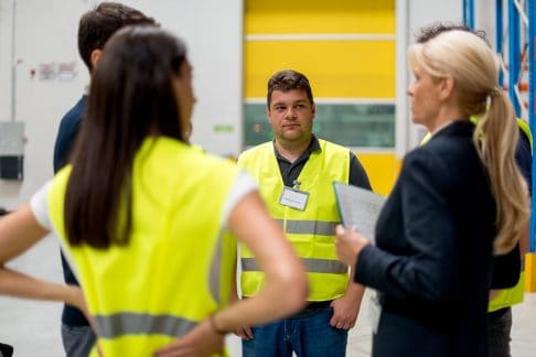 Image of concerned workers discussing issues