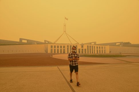 Canberra, Australia, 5/01/2020, Smoke coming from nearby forest fires creates high pollution and covers Canberra with a thick fog. People need to wear mask to breathe.