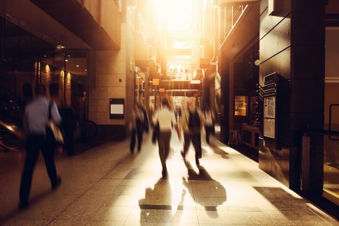 People walking down a busy Sydney street in the morning