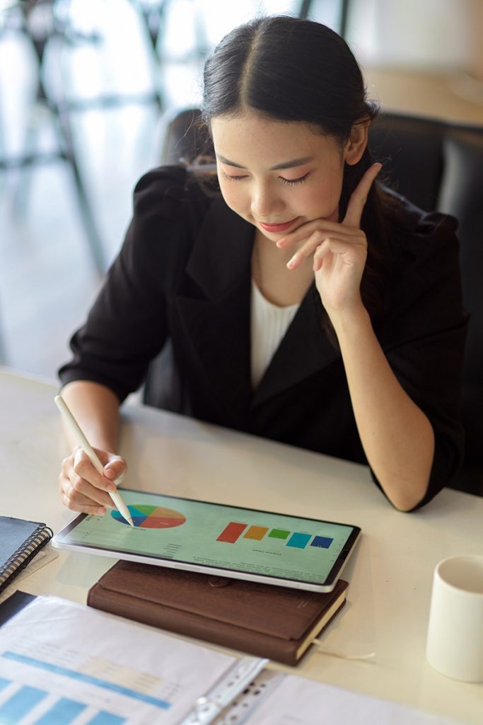 Woman making chart on a tablet